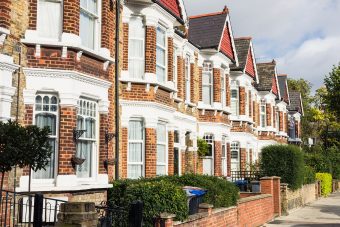 A row of terraced houses in the Queen's Park area of London.