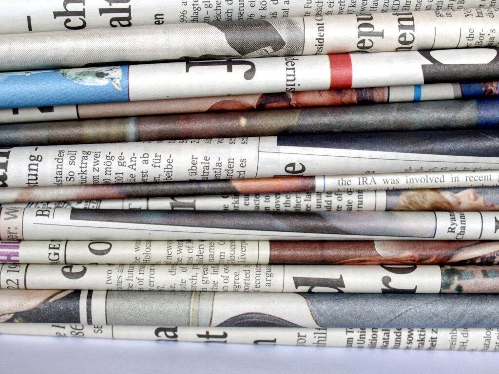 Stack of many international newspapers